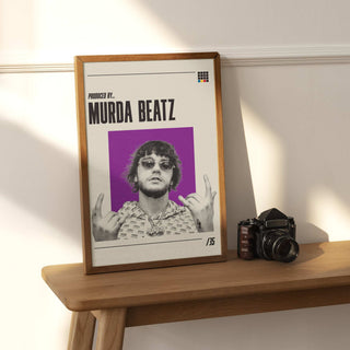 Murda Beatz poster on a wooden table, showcasing hip-hop producer artistry.