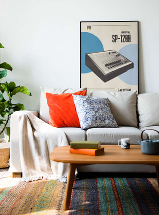 SP-1200 poster on a living room wall above a cozy sofa with colorful pillows and a wooden coffee table.