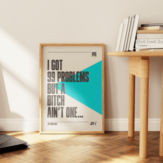 Jay-Z "99 Problems" lyrics poster in frame on a wooden floor.