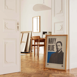 Navy Blue poster in room with wooden flooring and modern decor.