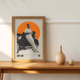 Larry June poster on wooden shelf, museum-quality matte paper, unframed.