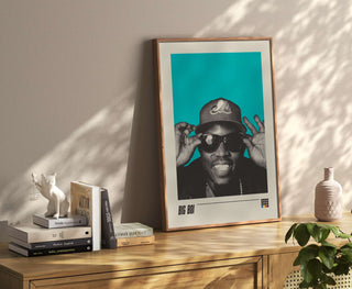 Big Boi poster with teal background on a wooden shelf, museum-quality print.