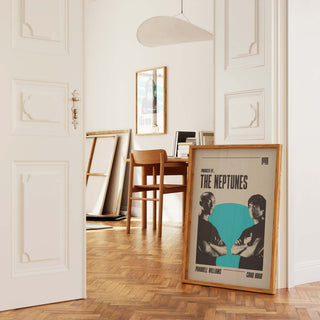 The Neptunes poster featuring Pharrell Williams and Chad Hugo in a stylish interior setting.