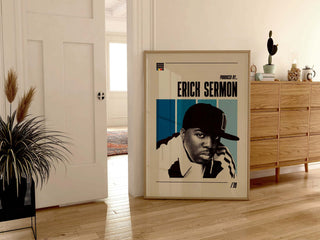 Erick Sermon poster in frame leaning against a wall in a stylish room.