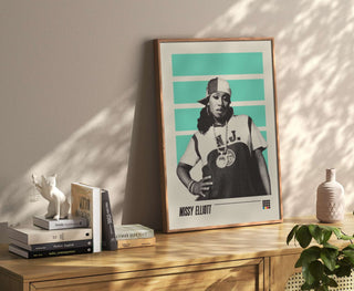 Missy Elliott museum-quality poster with vibrant colors, unframed, displayed on a wooden surface.